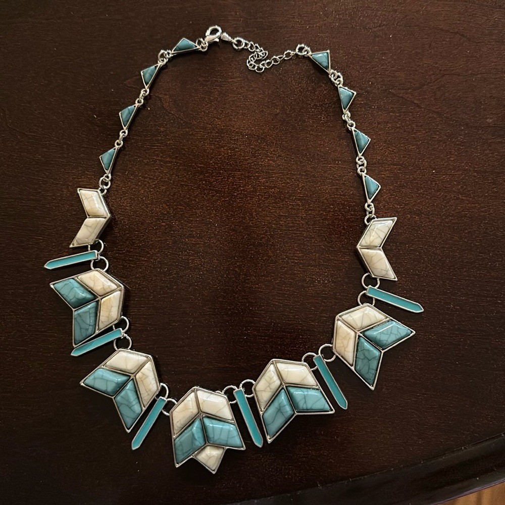 Turquoise and white simulated stone necklaces.